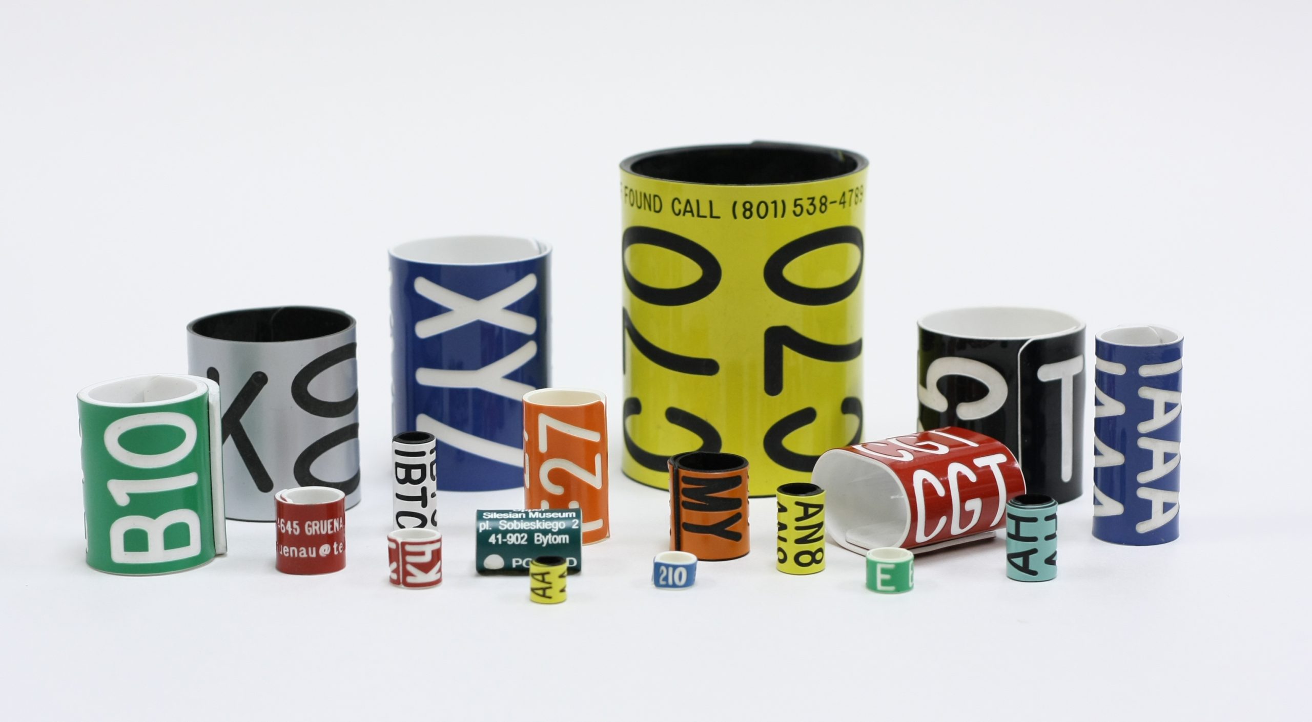 Pro-Touch Engraving Ltd. 2025 A variety of bird bands on a white table.